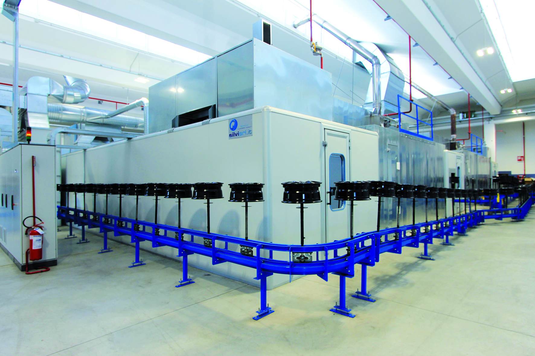 Conveyor integrated with finishing line